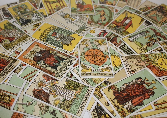 A pile of Tarot cards is spread out and jumbled